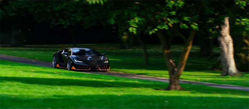 Lamborghini Centenario going through a field of green grass in Transformers: The Last Knight