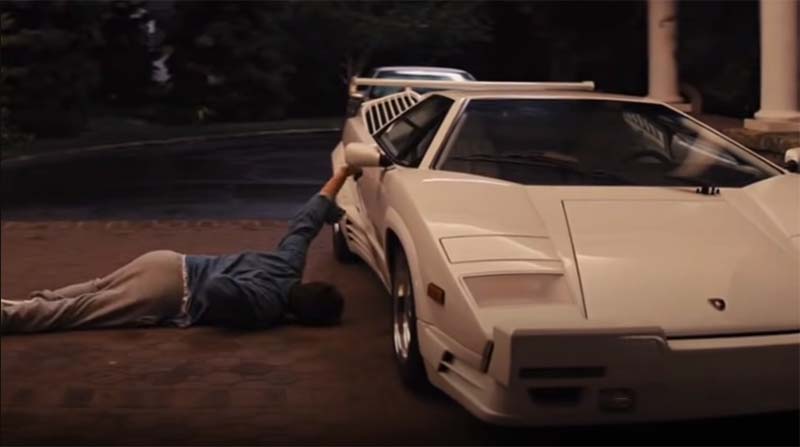 Leonardo DiCaprio crawling to his Lamborghini Countach in the film: Wolf of Wall Street 