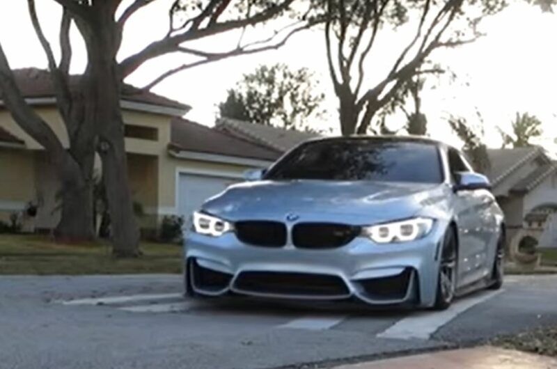 Low BMW going over a speedbump using the angle technique.