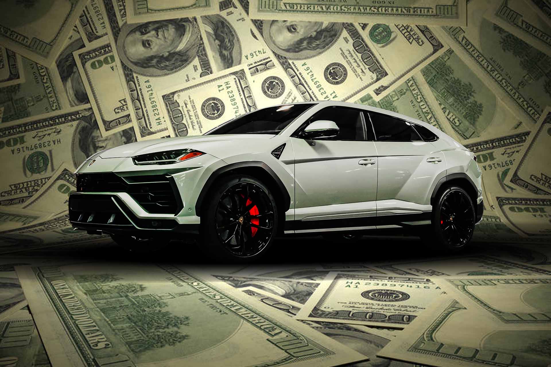 Lamborghini Urus with hundred dollar bills in the background.