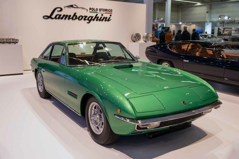 Green Lamborghini Islero at a vintage car show.