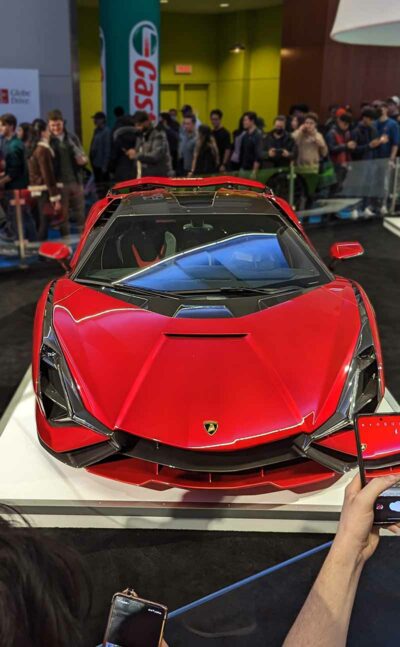 Red Lamborghini Sian front at an autoshow.