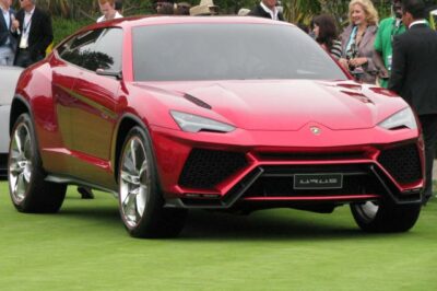 Why did Lamborghini unveil an SUV concept? Red Lamborghini Urus prototype at Pebble beach.