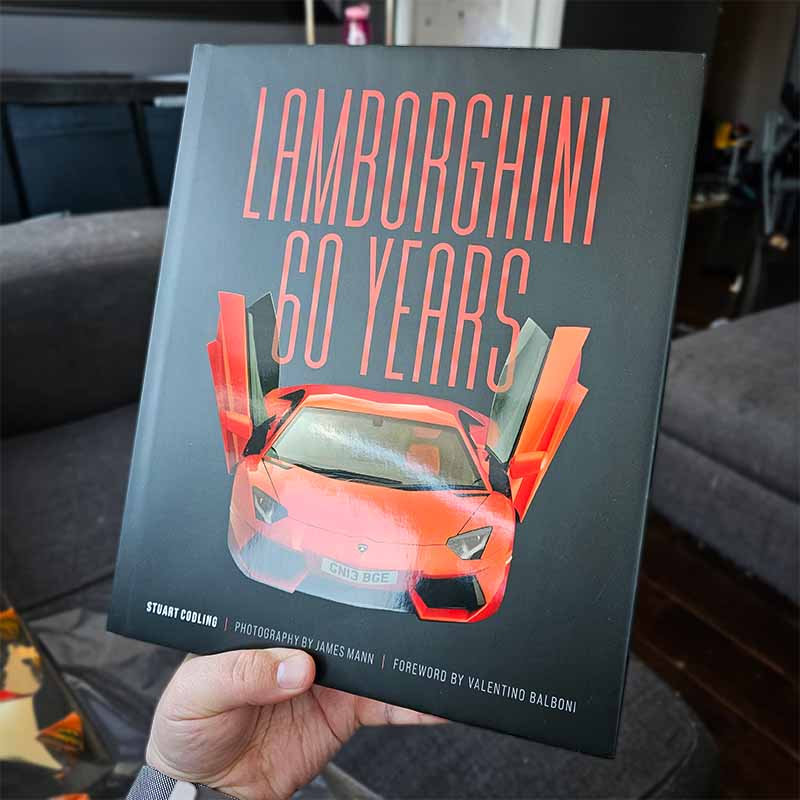 Front cover of the book Lamborghini 60 Years. Lamborghini Aventador on the cover.