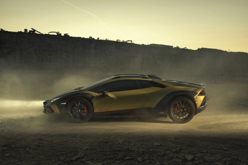 Golf Lamborghini Huracán Sterrato parked in a dusty quarry at dusk.